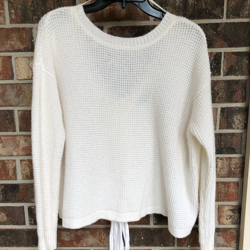 1. State sweater with V back detail